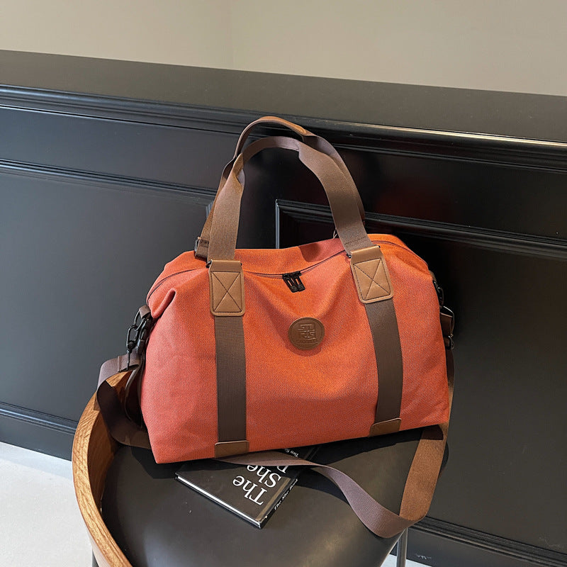 Sporty Duffel Bag with Multiple Compartments and Adjustable Shoulder Strap