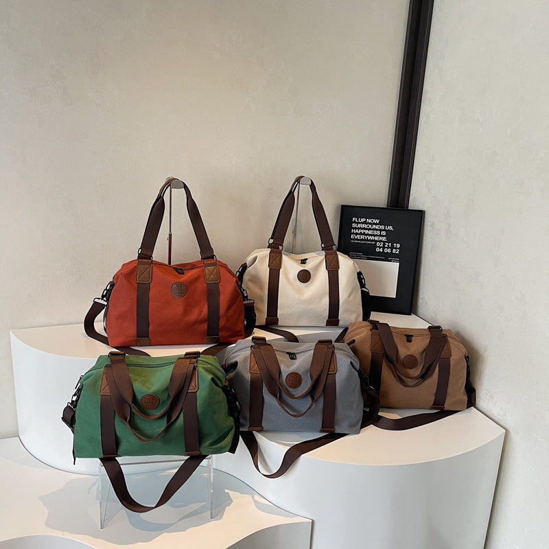 Sporty Duffel Bag with Multiple Compartments and Adjustable Shoulder Strap